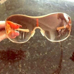 Oakley Sunglasses. Gold and bronze in case.